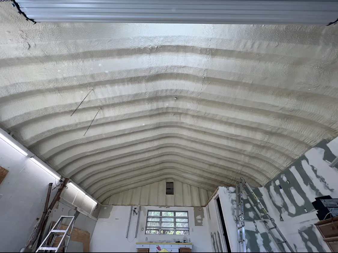 Spray polyurethane foam applied to the underside of a metal roof deck in Attleboro